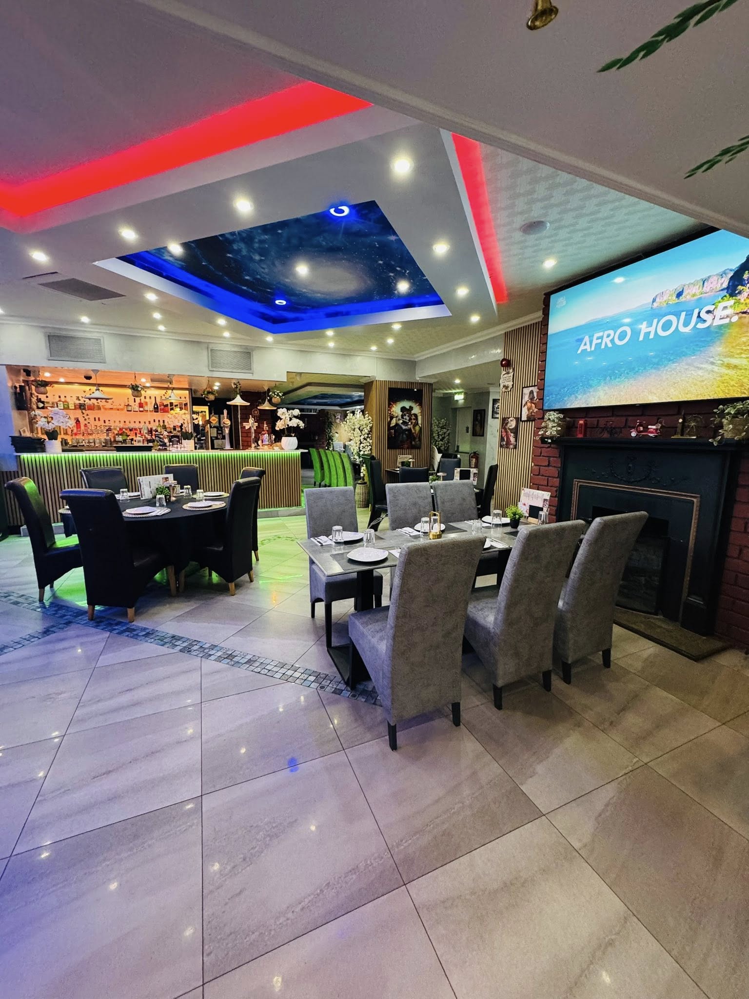 Bacaba Restaurant Oldbury, main dining area with big screen, bar visible and ambient ceiling lights