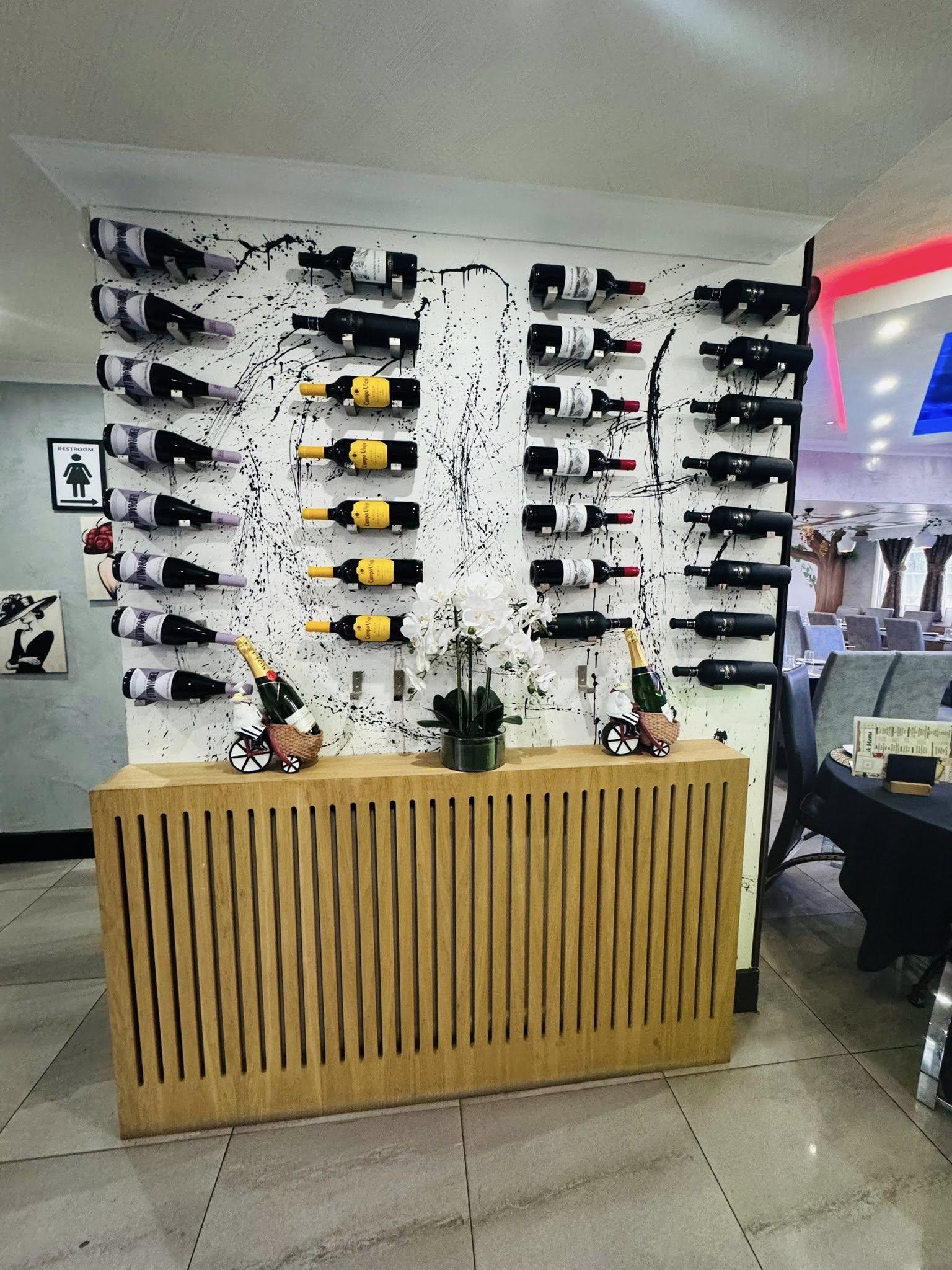 Bacaba Restaurant Oldbury, wine wall display with artistic splatter backdrop